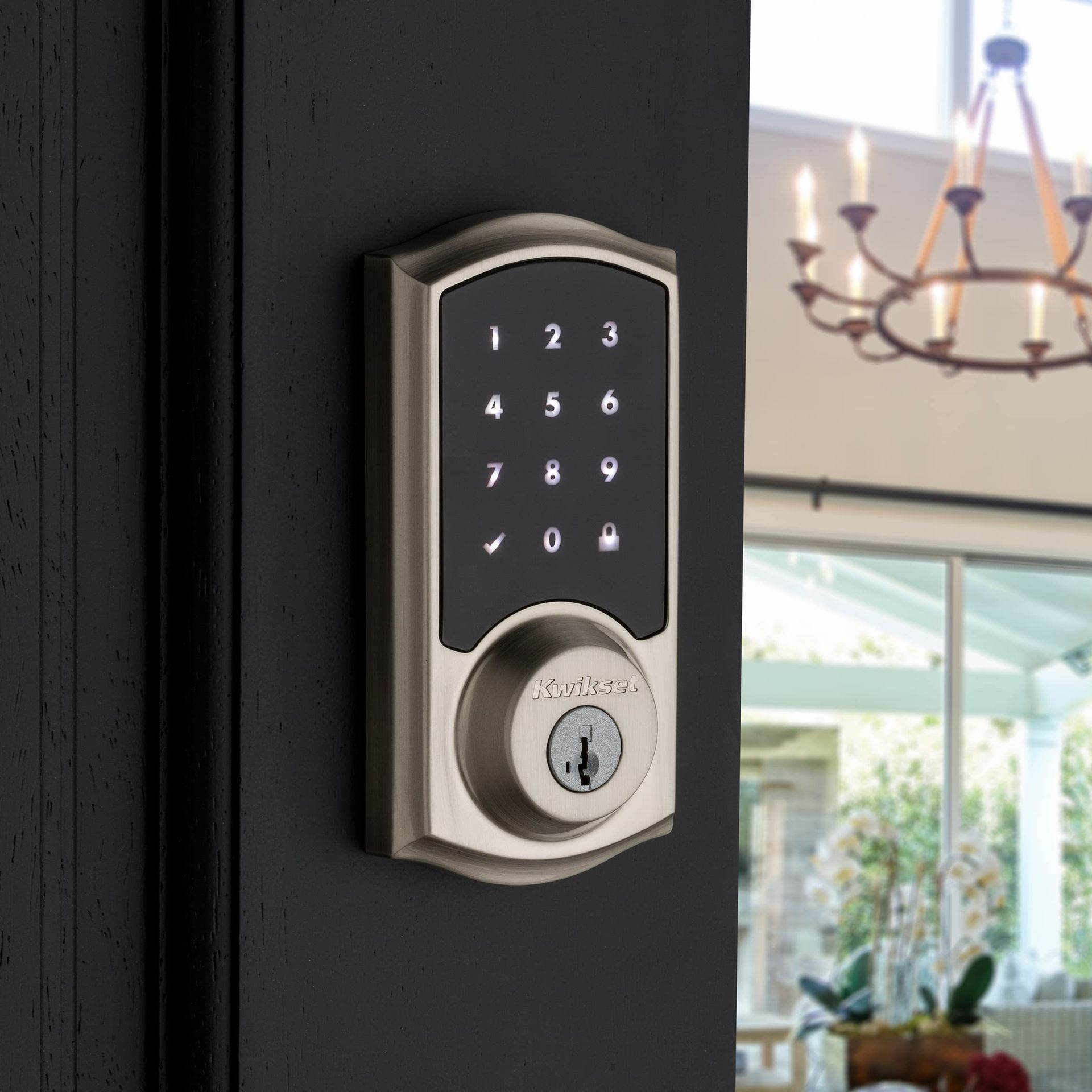 Smart door lock with illuminated keypad providing keyless home entry.