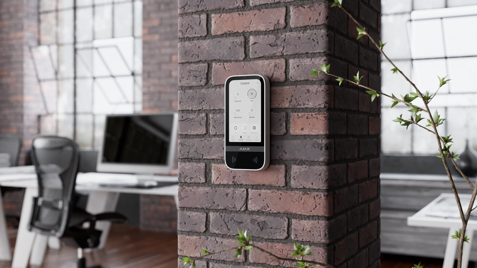 Ajax touchscreen keypad mounted on interior brick wall for smart access control.