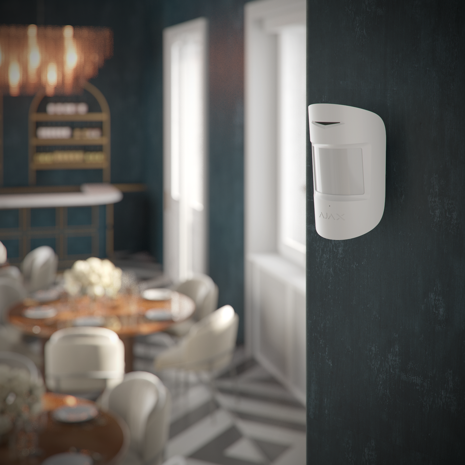 Ajax motion sensor mounted inside modern room for smart intrusion detection.