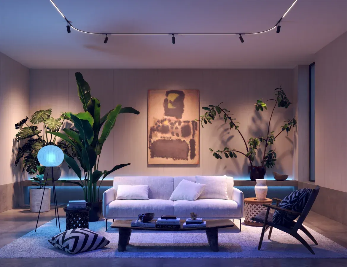 Modern living room with Pure Smart Lighting accent lights and biophilic design elements.