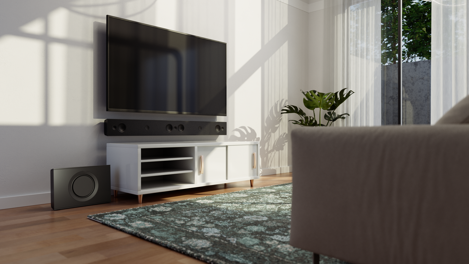 Living room with TV, soundbar, subwoofer, and white cabinet. Green rug and plant. Sunlight through window.