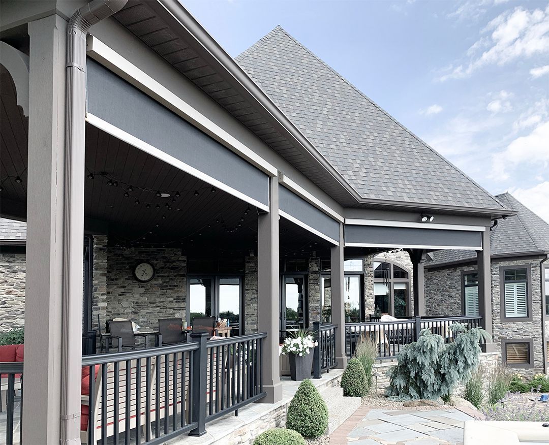 Smart outdoor shades installed on a luxury patio for sunlight and privacy control