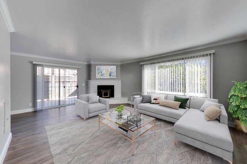 modern living room with a couch and a fireplace