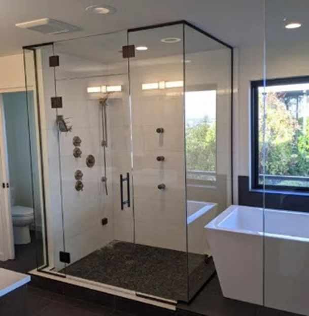 A bathroom with a bathtub and a shower stall A bathroom with a bathtub and a shower stall