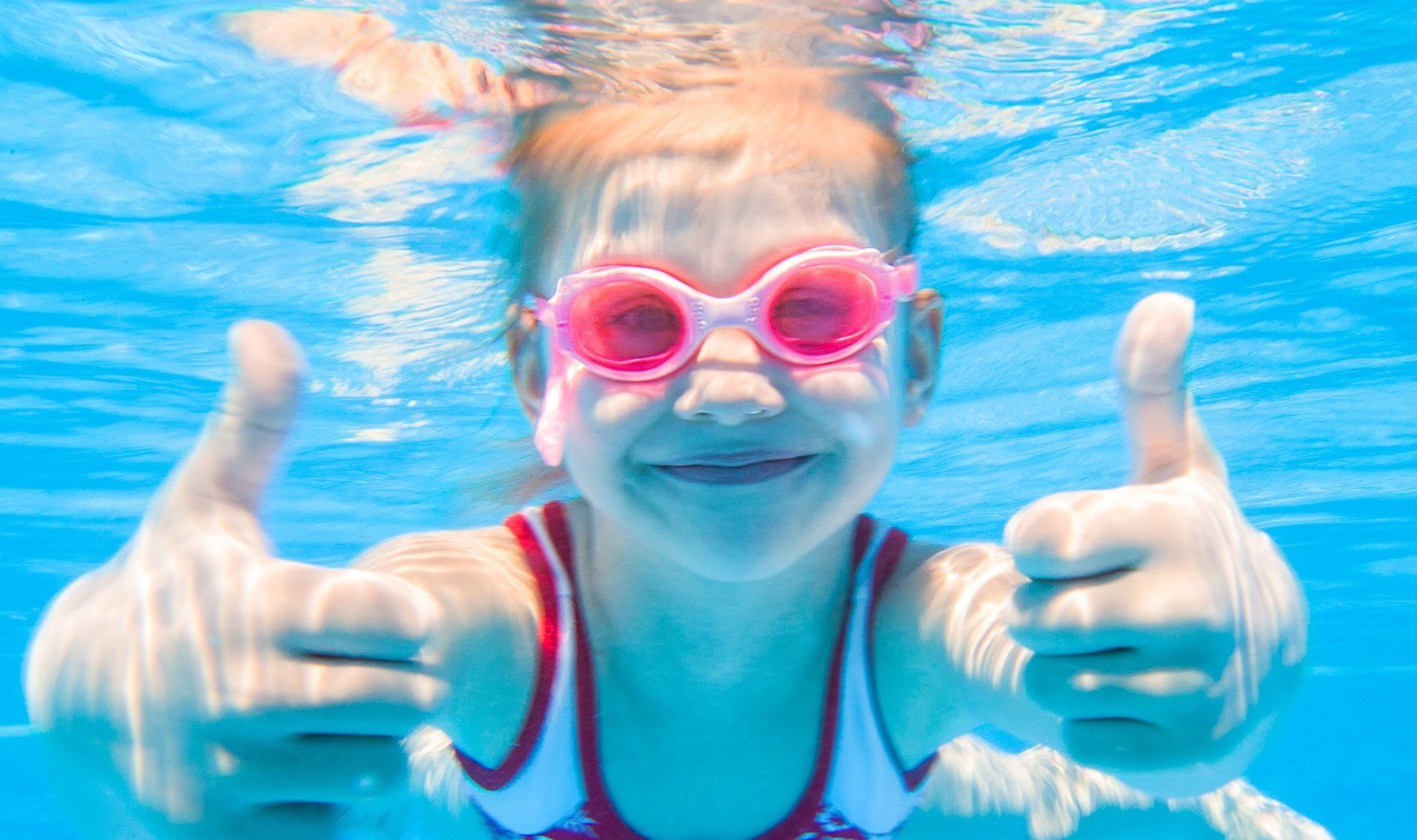 Girl swimming in goggles Girl swimming in goggles