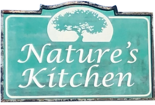 A sign that says nature 's kitchen with a tree on it.
