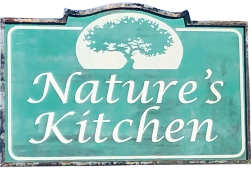A sign for nature 's kitchen with a tree on it