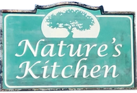 A sign for nature 's kitchen with a tree on it