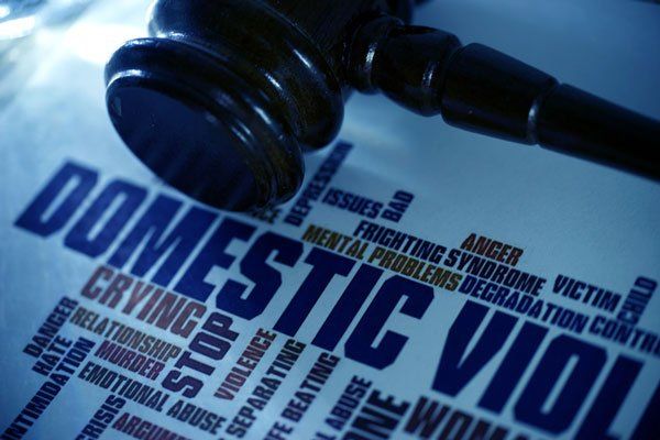 gavel next to paper saying domestic violence