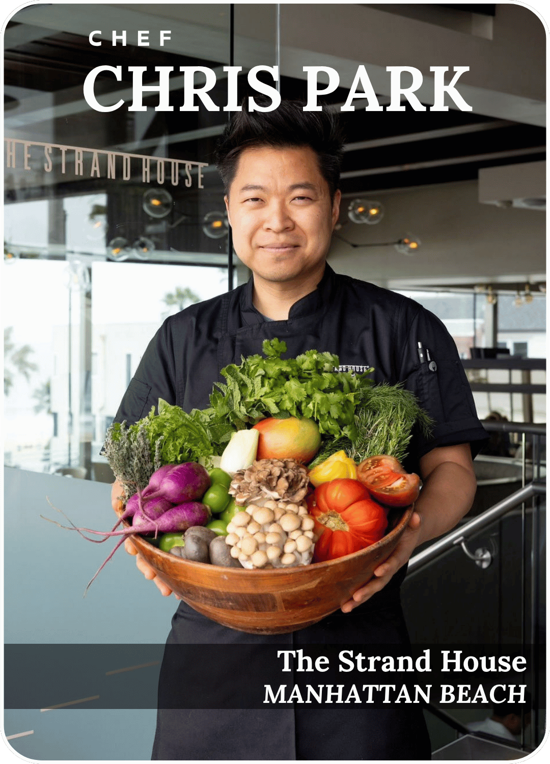 Chef Chris Park holding a basket of fresh vegetables at The Strand House, Manhattan Beach