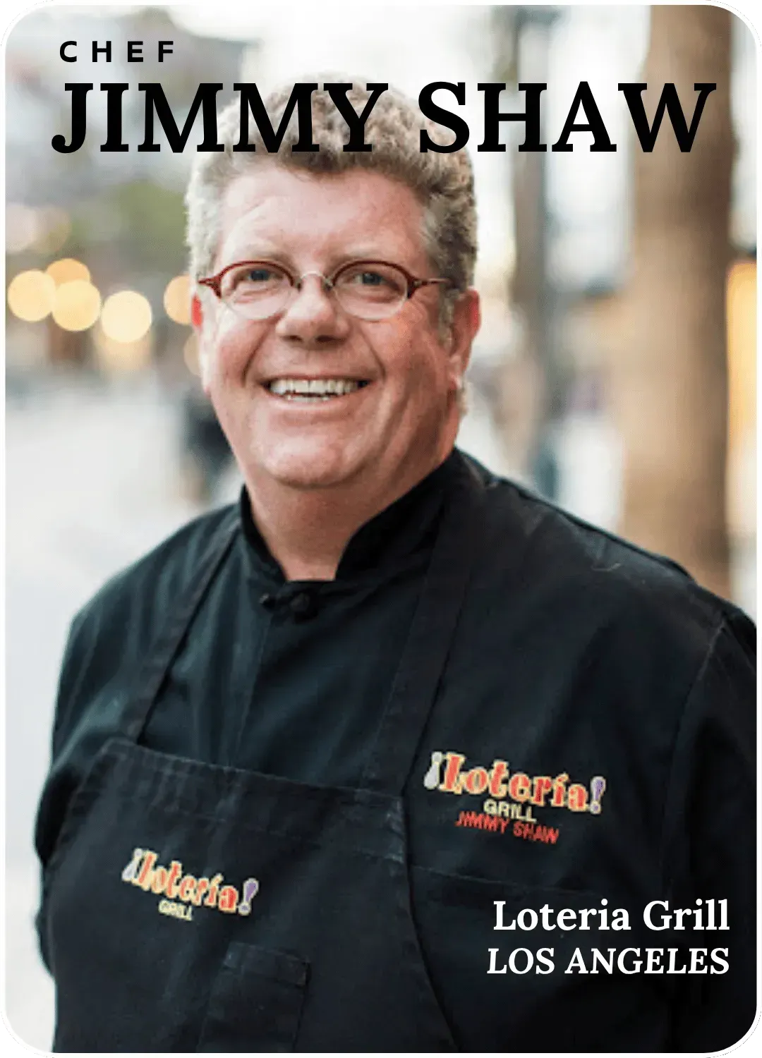 Chef Jimmy Shaw smiling in a black chef coat for Loteria Grill, Los Angeles