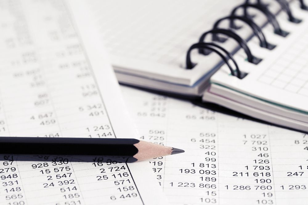 Pencil Resting on Financial Documents, With a Spiral Notebook in the Background — Accountsloop Tax & Business Advisory in Geelong, VIC