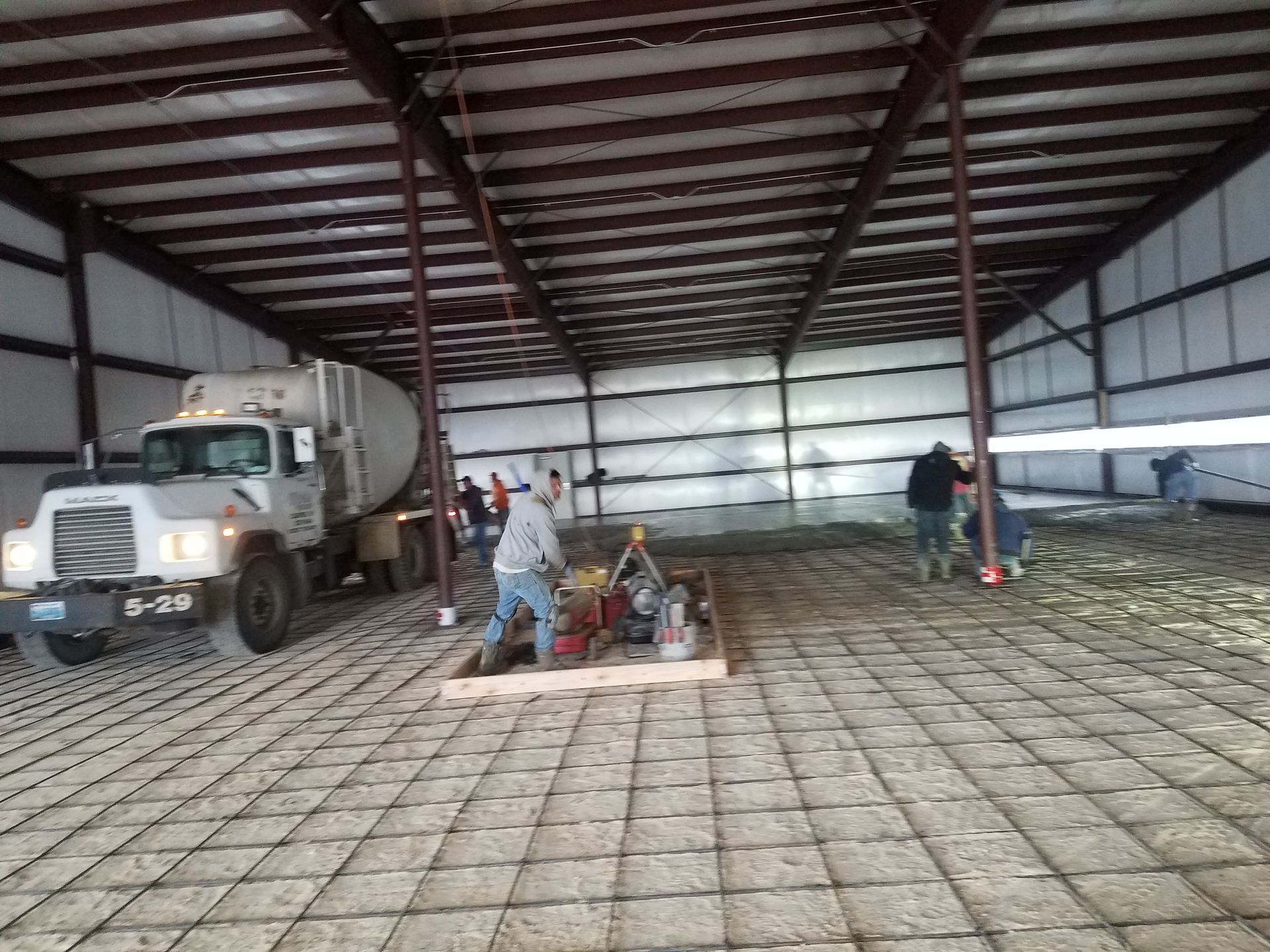 Completed concrete driveway replacement with reinforced construction and clean finish.