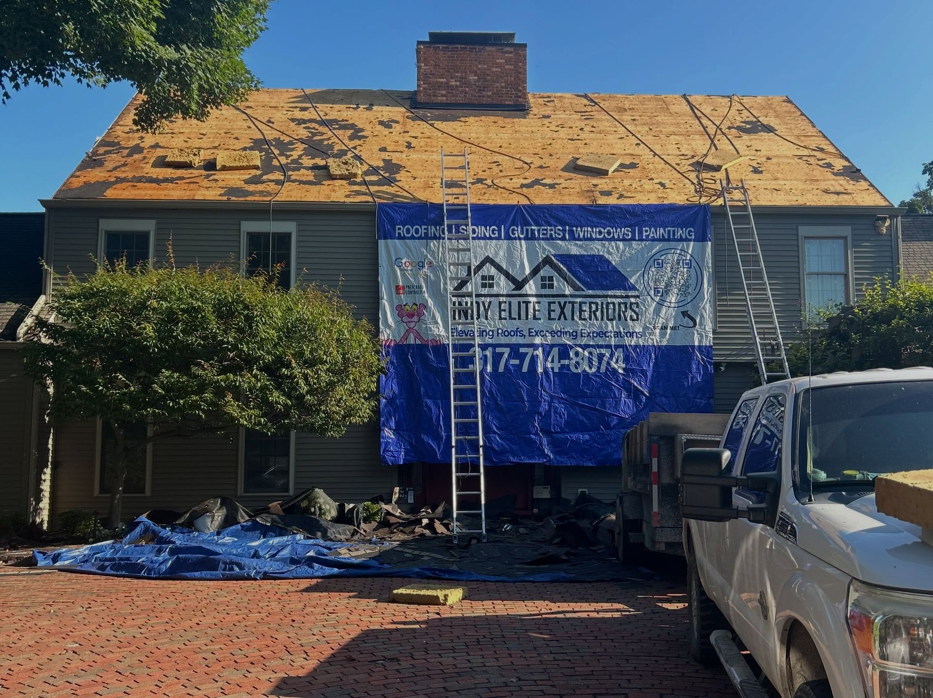 Before image of a house undergoing a roof replacement