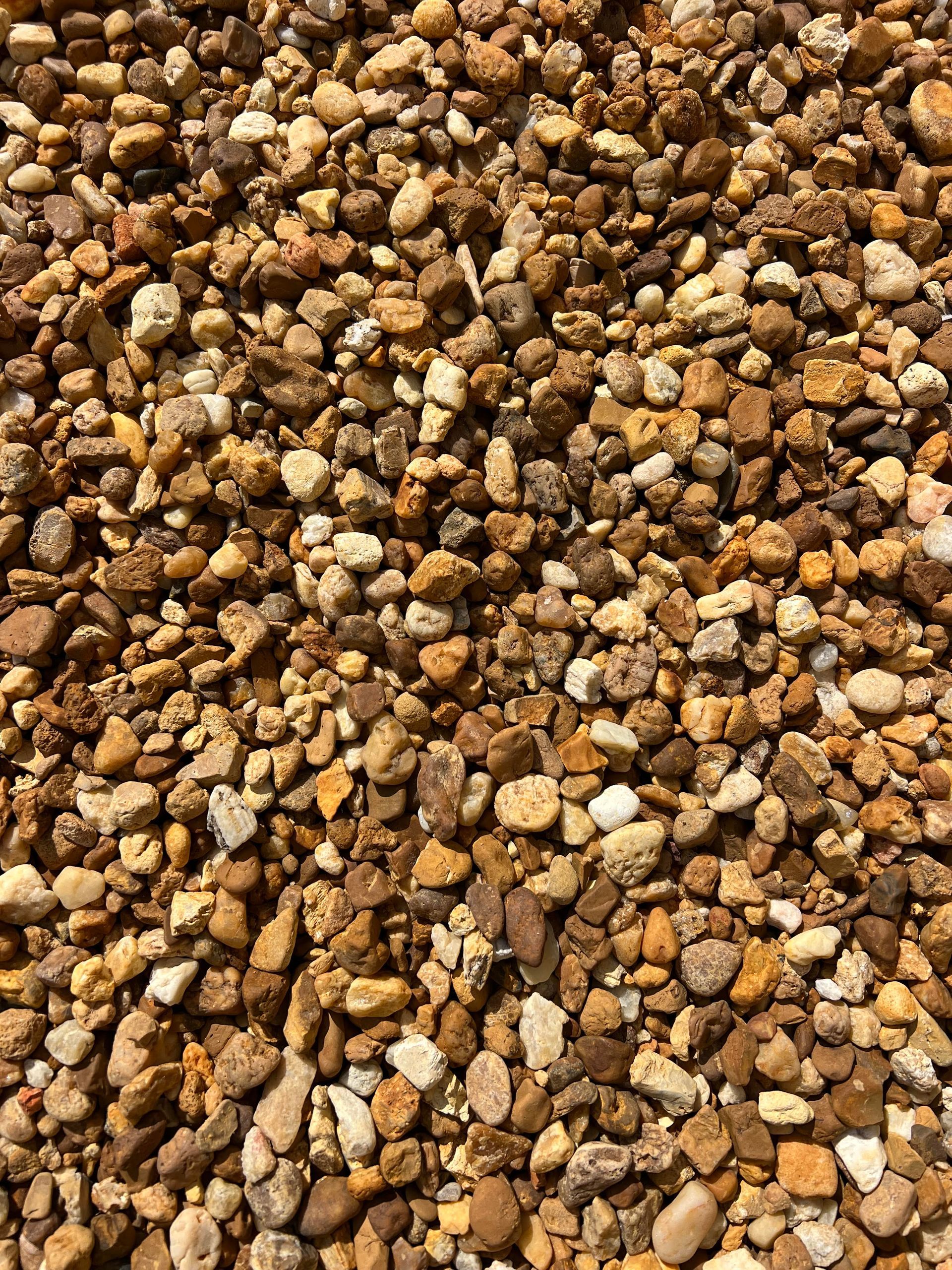 A pile of rocks of different sizes and colors.