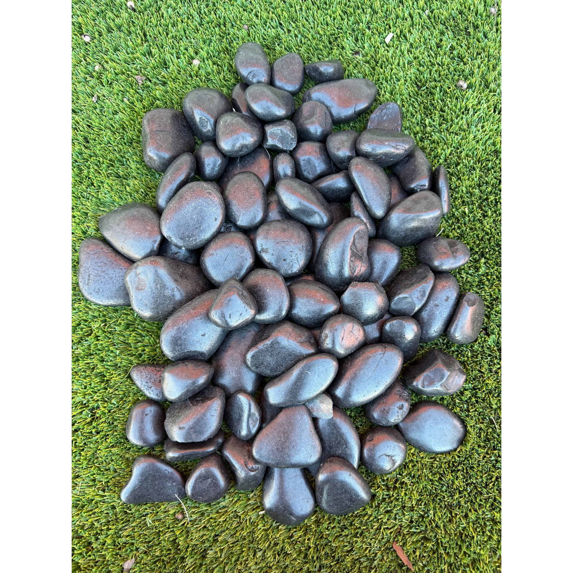 A pile of rocks is sitting on the ground.