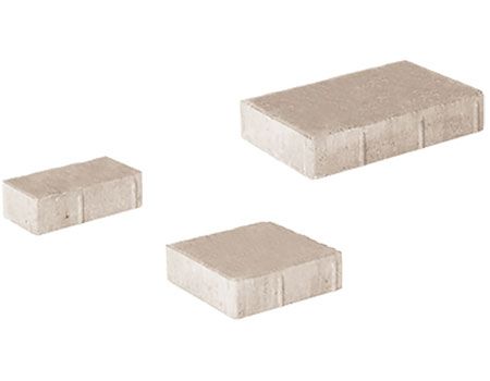 Three bricks of different sizes are stacked on top of each other on a white background.