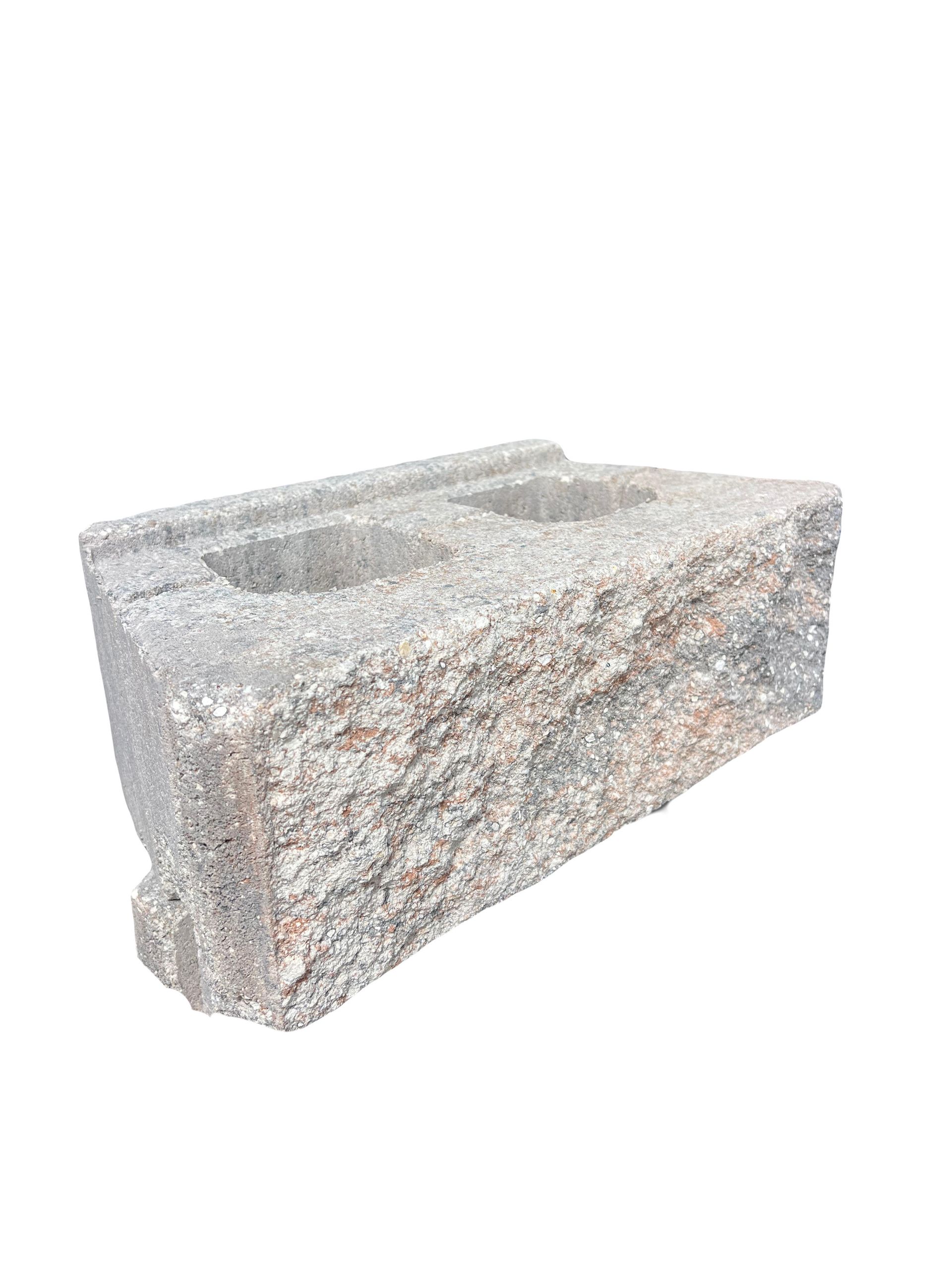 A close up of a concrete block on a white background.