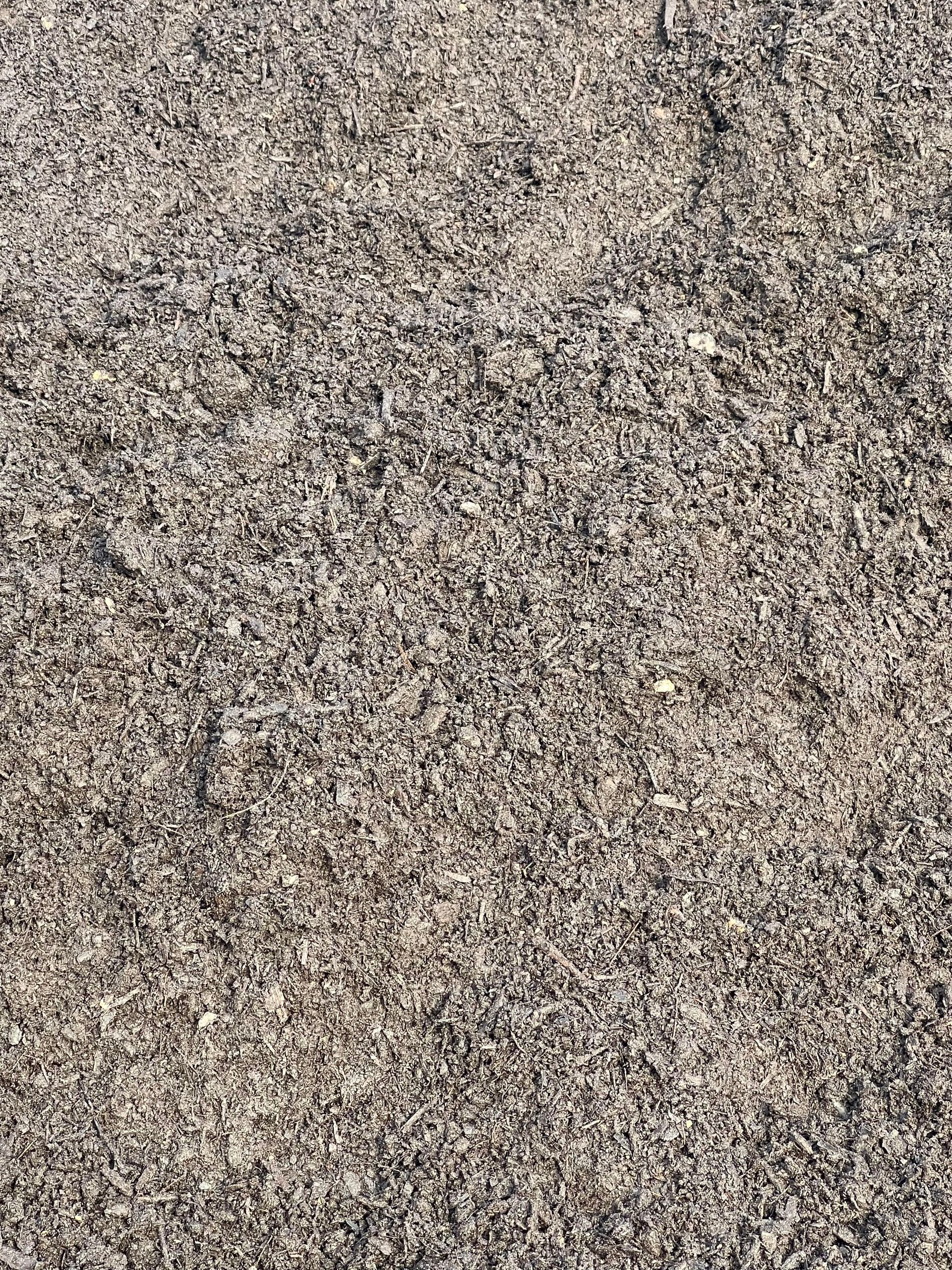 A close up of a pile of gravel on the ground.