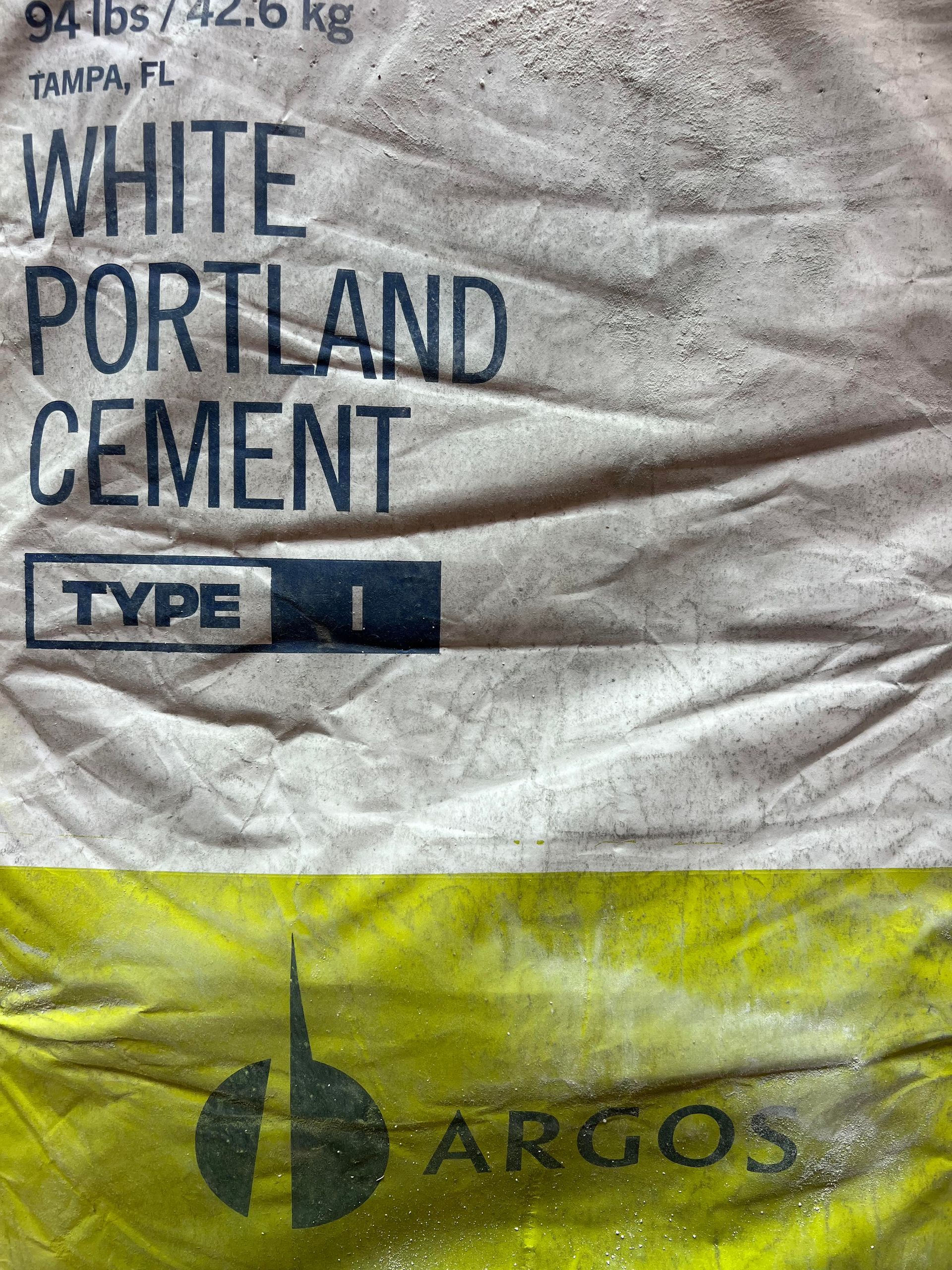 A bag of white portland cement type i