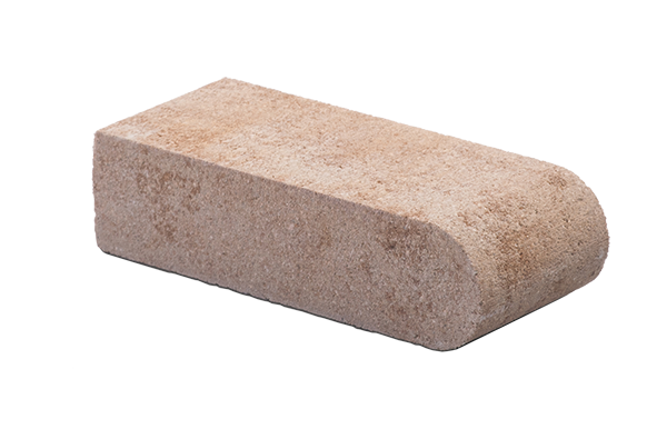 A brown brick is sitting on a white surface.