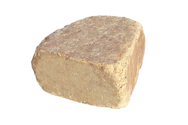 A piece of rock is sitting on a white surface.