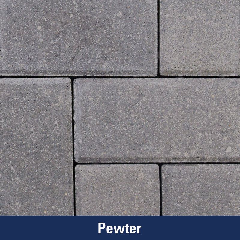 A close up of a pewter brick wall