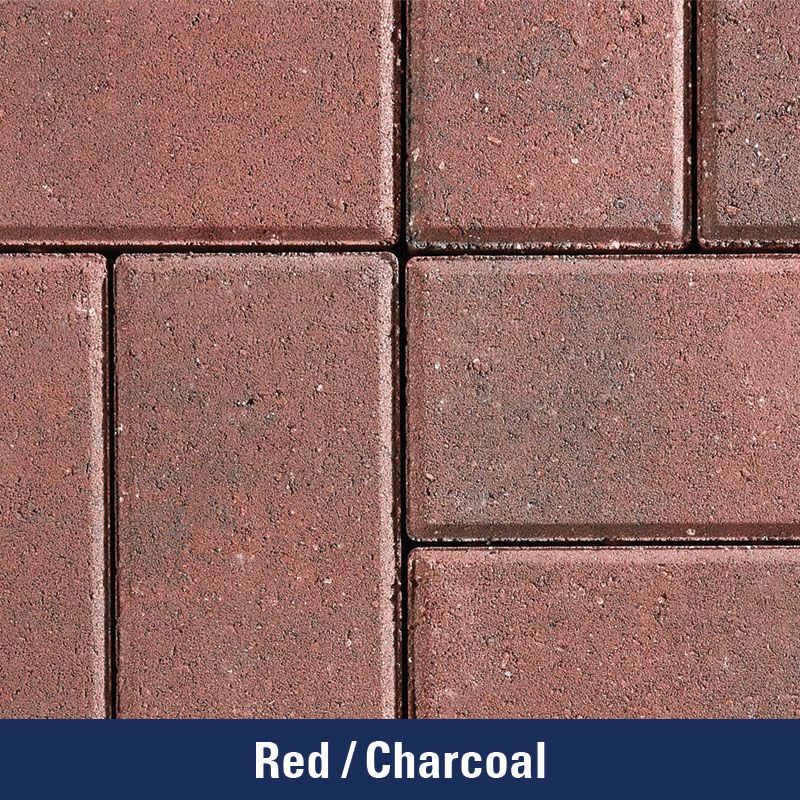 A close up of a red / charcoal colored brick