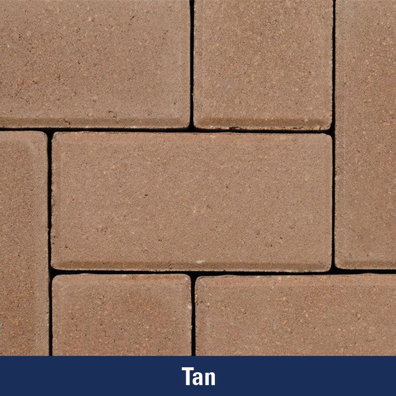 A close up of a tan colored brick wall