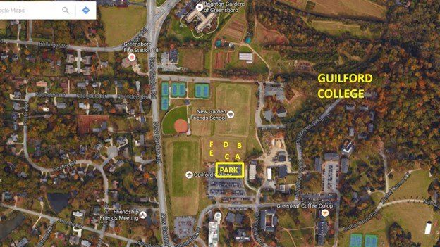 Aerial map of Guilford College campus with fields, buildings, roads, and surrounding neighborhood.