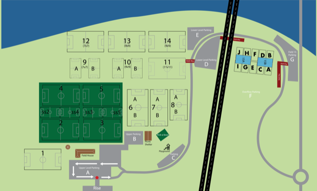 Aerial site plan with numbered lots, green building blocks, roads, and a blue area at the top right