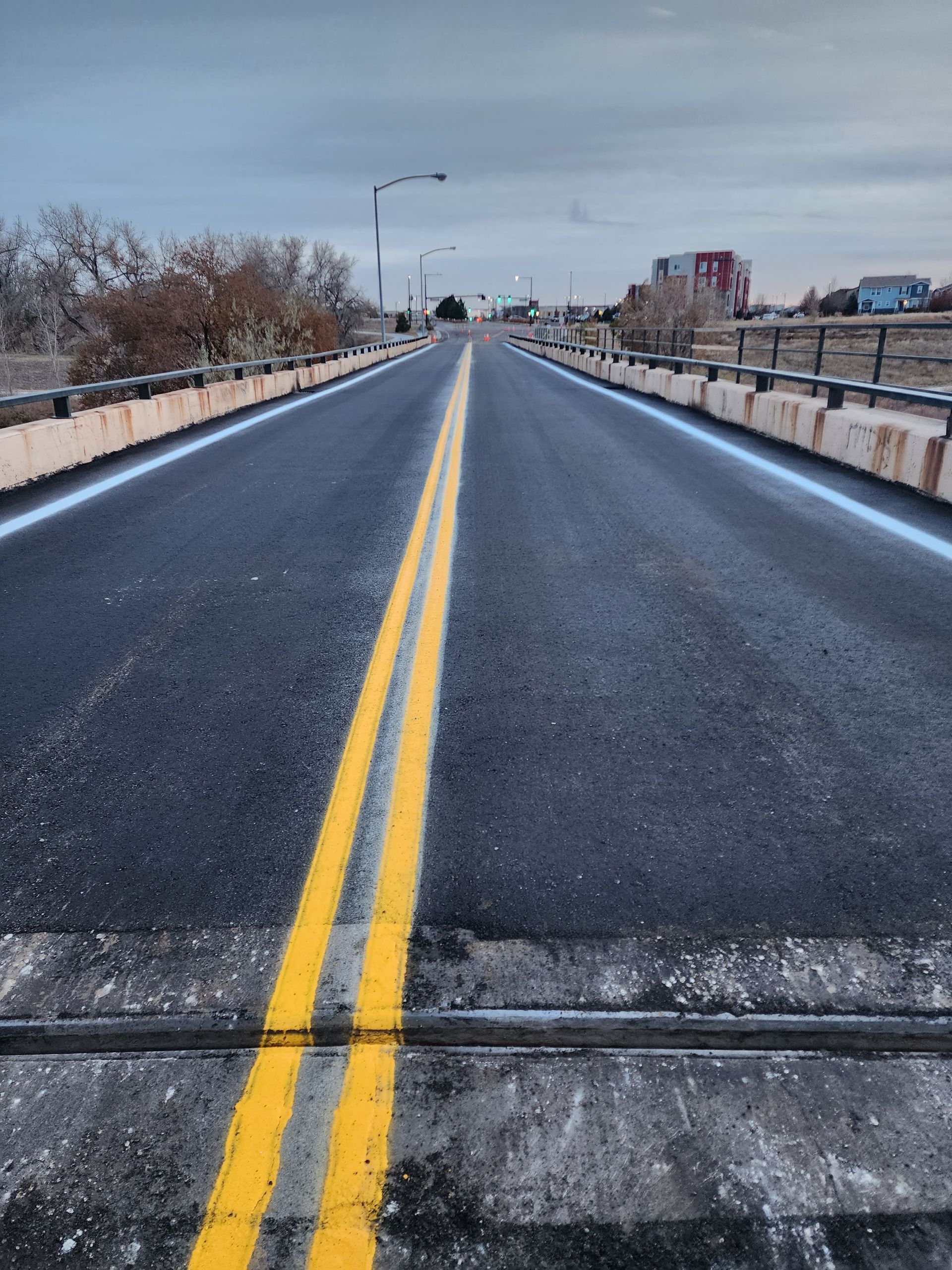 A group of construction workers are working on a concrete surface.