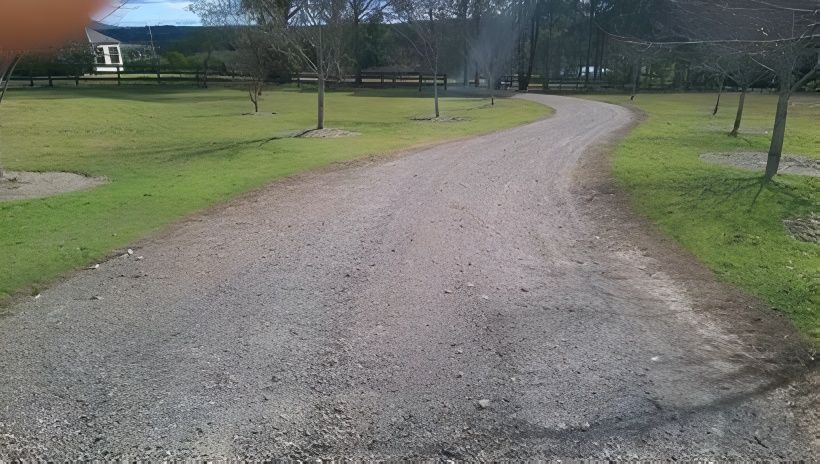 A Gravel Road Going Through a Grassy Field — Hunter Valley Bitumen In Maitland, NSW
