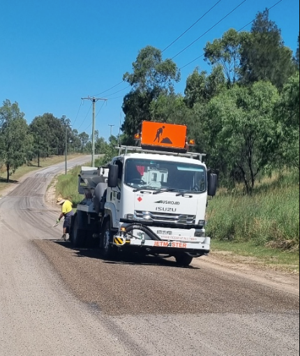 Truck spraying bitumen on road.— Hunter Valley Bitumen In Maitland, NSW