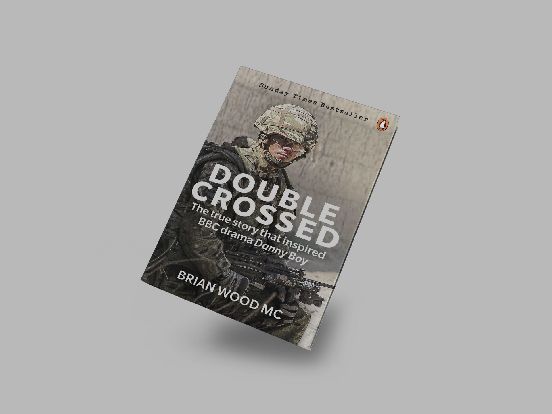 A book titled double crossed by brian wood mc is floating in the air.