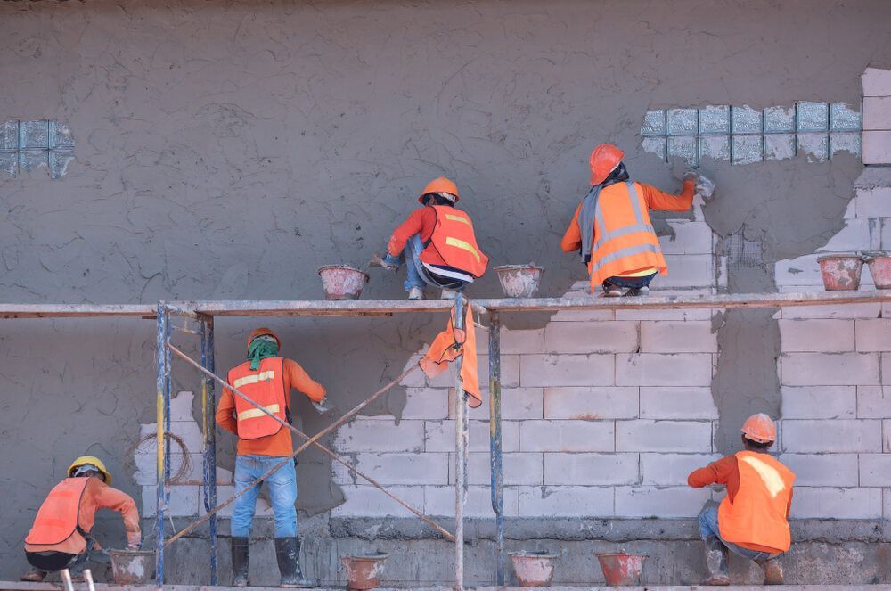 Three Workers Engaged in Civil Construction — Bustin' Free Earthworks in Bathurst, NSW