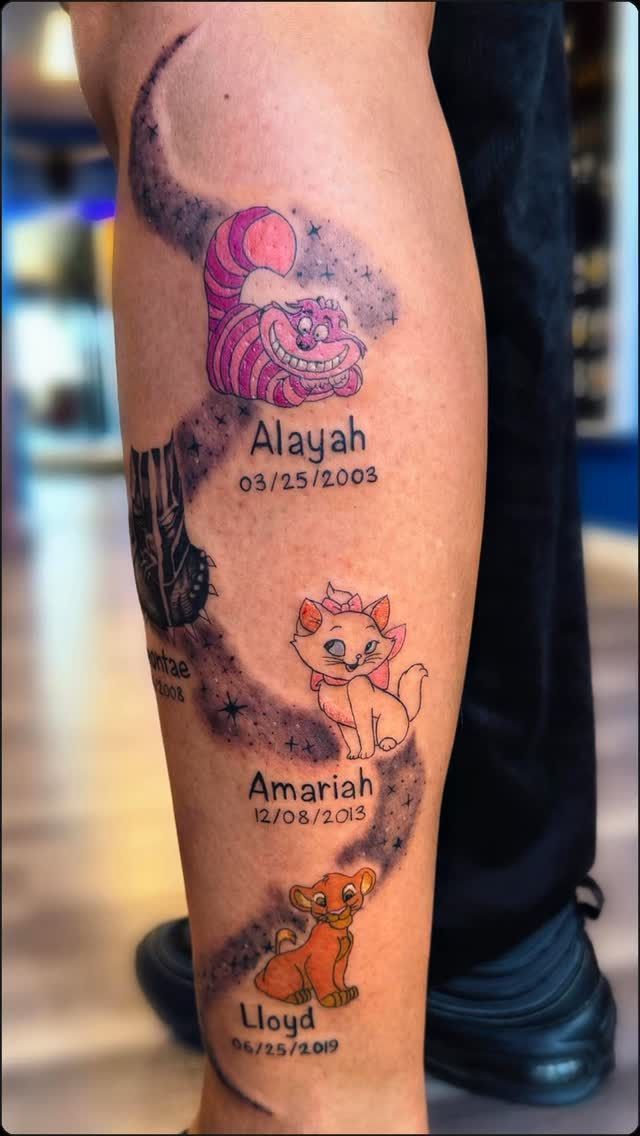 A tattoo on a leg features the Cheshire Cat, Marie from The Aristocats, and Simba, with names and dates written below each.