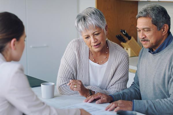 Senior Couple Meeting with Consultant — Willits, CA — Cantua Insurance Senior Couple Meeting with Consultant — Willits, CA — Cantua Insurance
