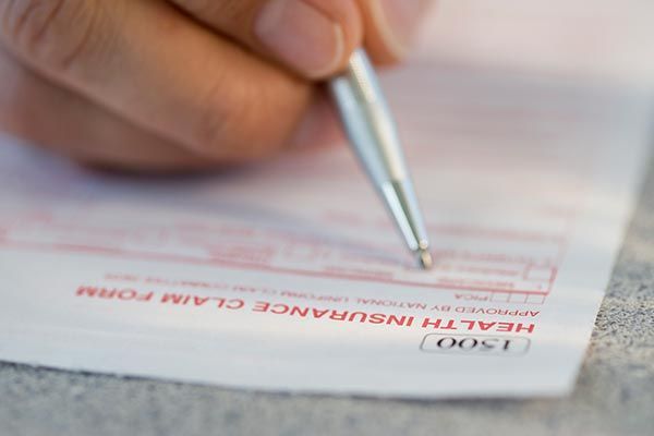 Filling Out Health Insurance Claim Form — Willits, CA — Cantua Insurance