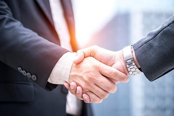Businessman Shaking Hand — Willits, CA — Cantua Insurance