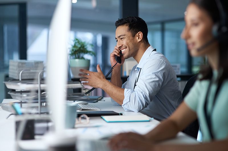 Man Using Telephone