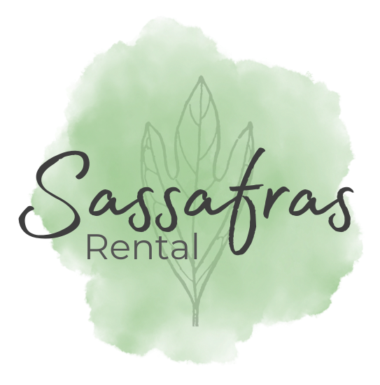 A logo for sassafras rental with a green background