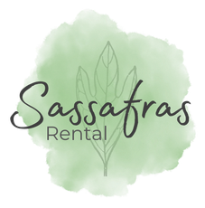 A logo for sassafras rental with a green background