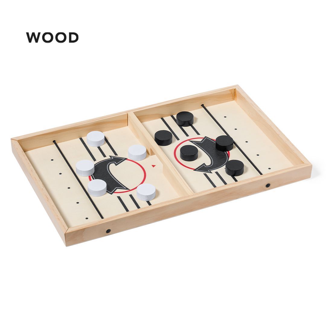 Un tablero de madera para un juego de lanzamiento rápido de discos, con discos blancos y negros a cada lado de un separador central con una puerta.