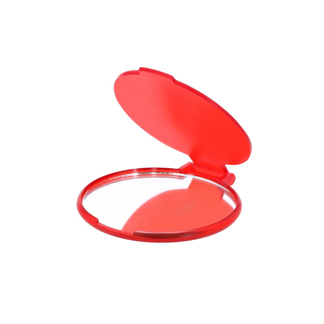 Un pequeño espejo compacto circular de color rojo, con la tapa abierta, que se muestra sobre un fondo blanco liso.