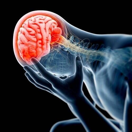 A person is holding their head in pain because of a headache.