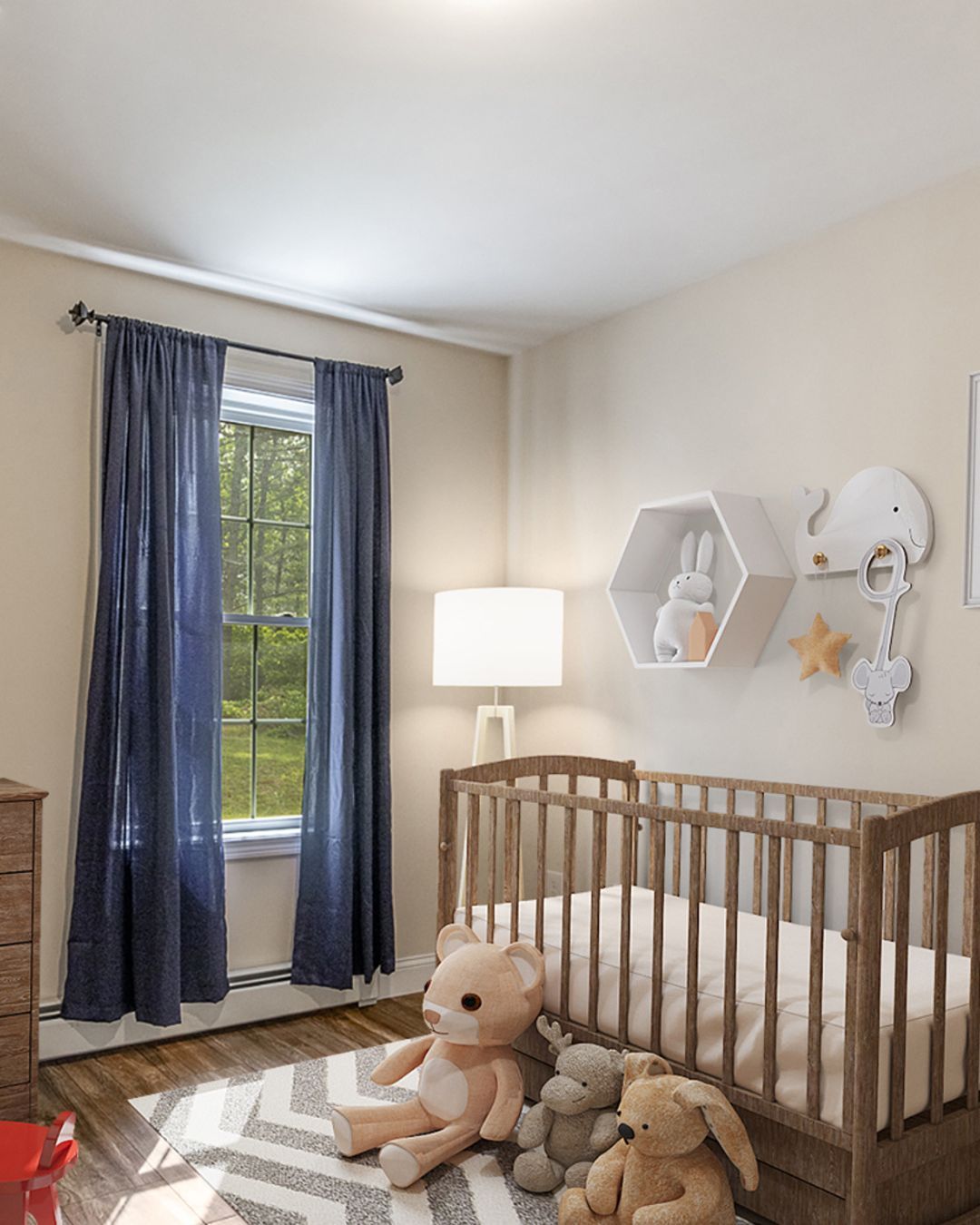 Cozy nursery with crib, lamp, blue curtains, plush toys, and wall shelves by a window.