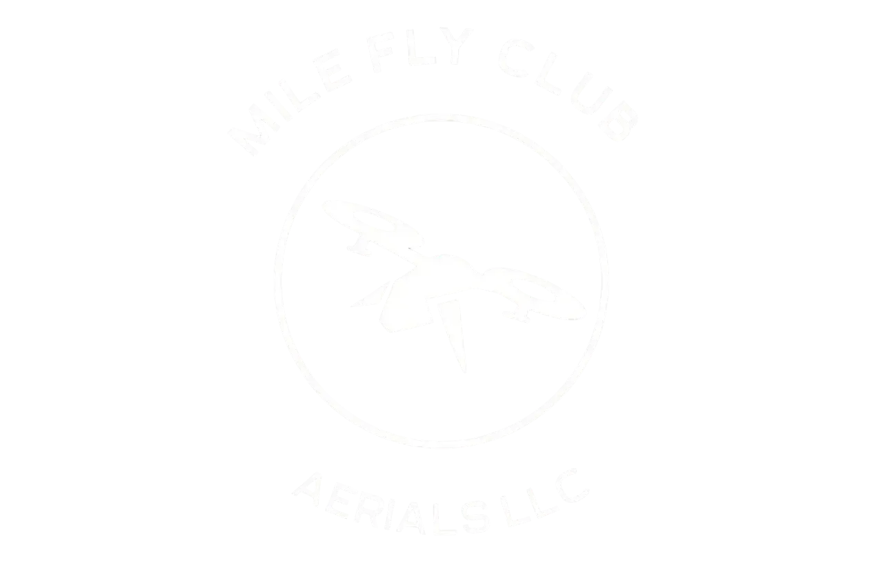 Faint circular logo with a central leaf emblem on a white background