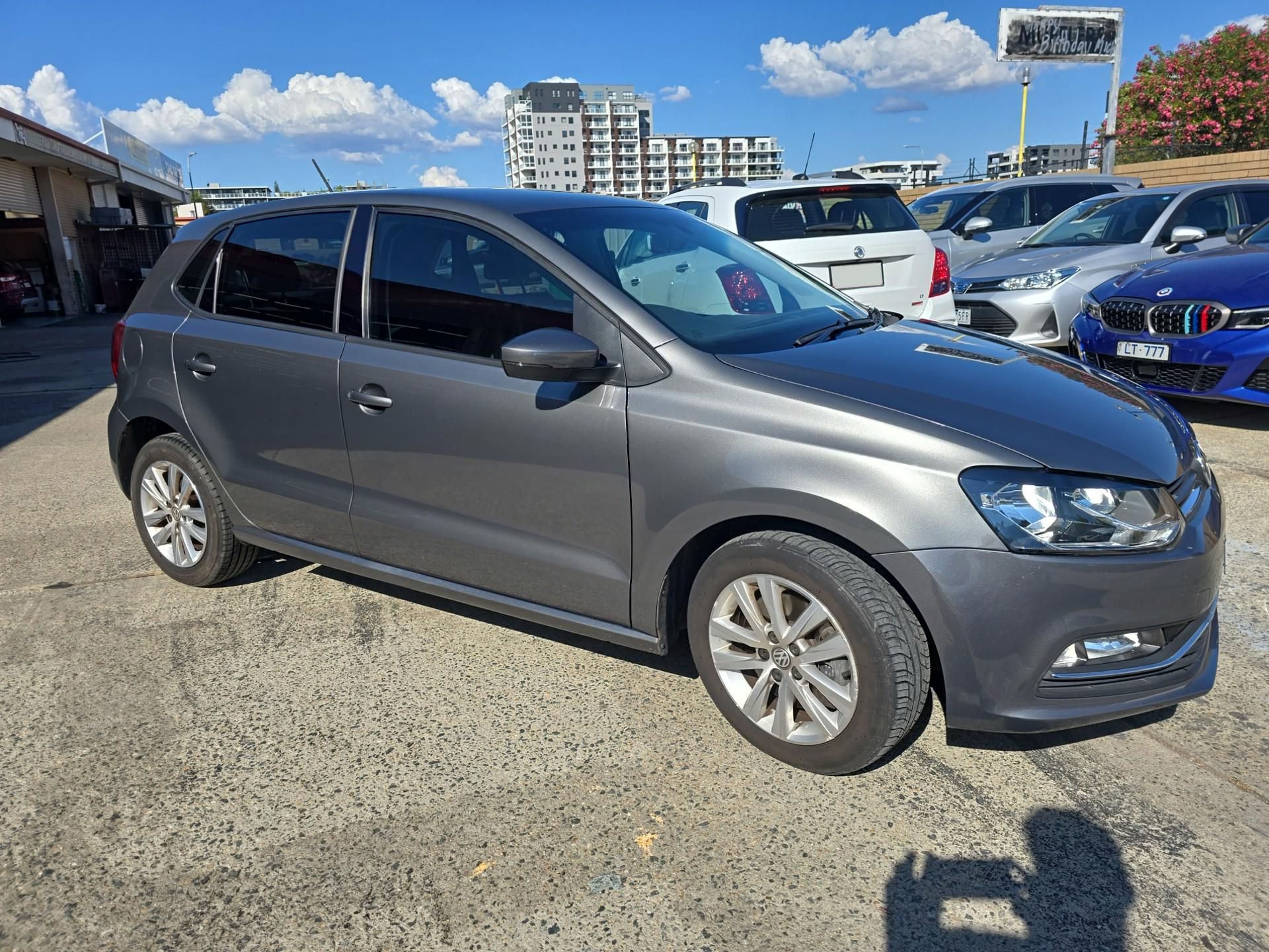 A grey car is sitting on a driveway — Southside Bodyworks in Greenway, ACT