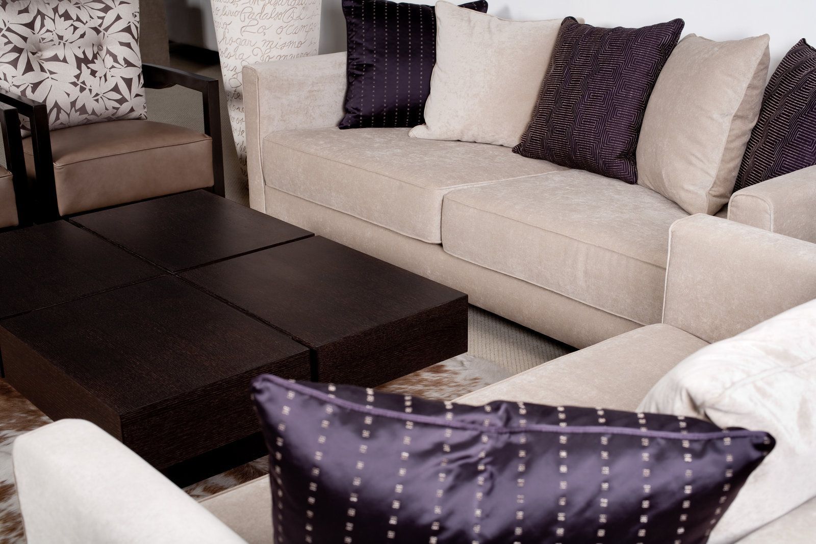a living room filled with furniture and pillows